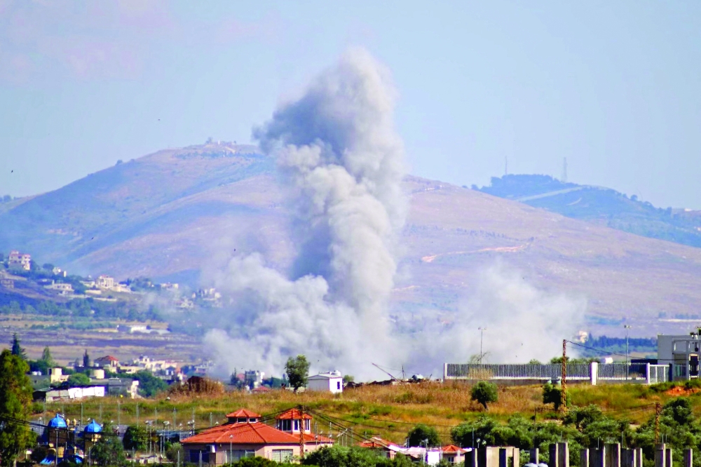 Smoke rises from the site of an Israeli airstrike that targeted the southern Lebanese village of Kfar Tibnit on Saturday. — AFP REPORT ON P7