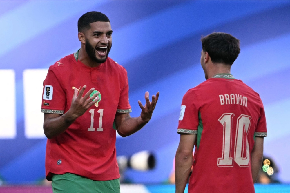 Morocco's midfielder #11 Ismael Saibari celebrates scoring his team's first goal with forward #10 Brahim Diaz. — AFP
