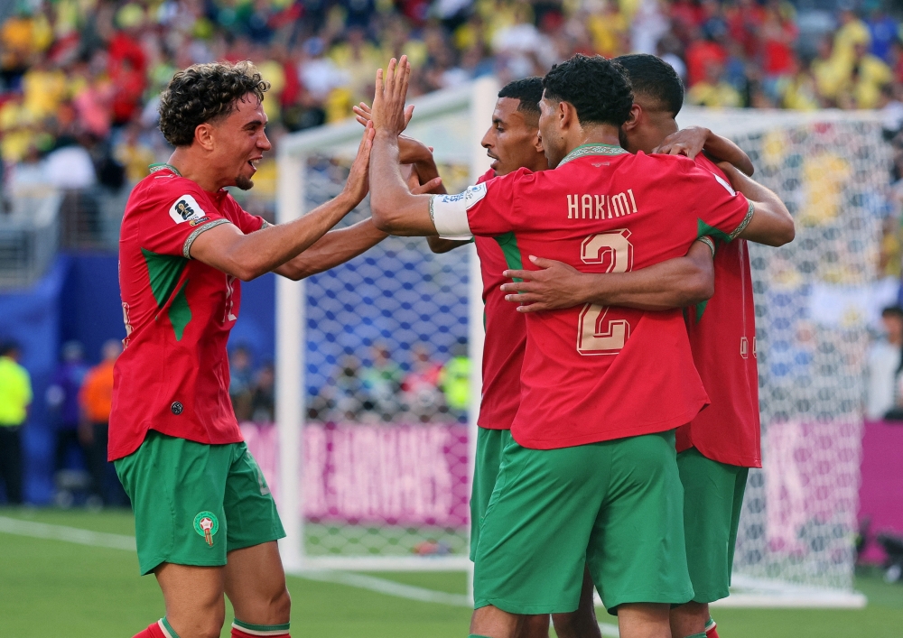 
Morocco's Ismael Saibari celebrates scoring their first goal with Achraf Hakimi and Neil El Aynaoui. — Reuters