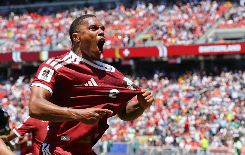 
Qatar's Pedro Miguel celebrates after Boualem Khoukhi scored their first goal. — Reuters
