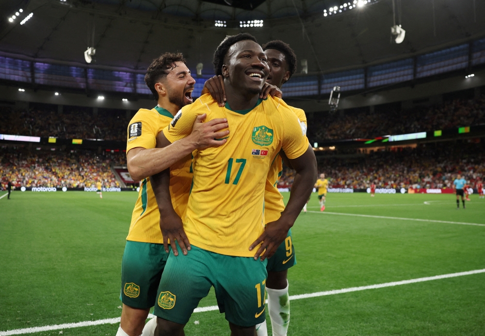 Australia's Nestory Irankunda celebrates scoring their first goal. — Reuters