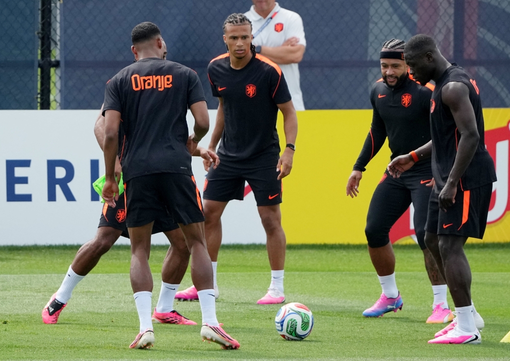 
Netherlands' Nathan Ake and Memphis Depay with teammates during training. — Reuters