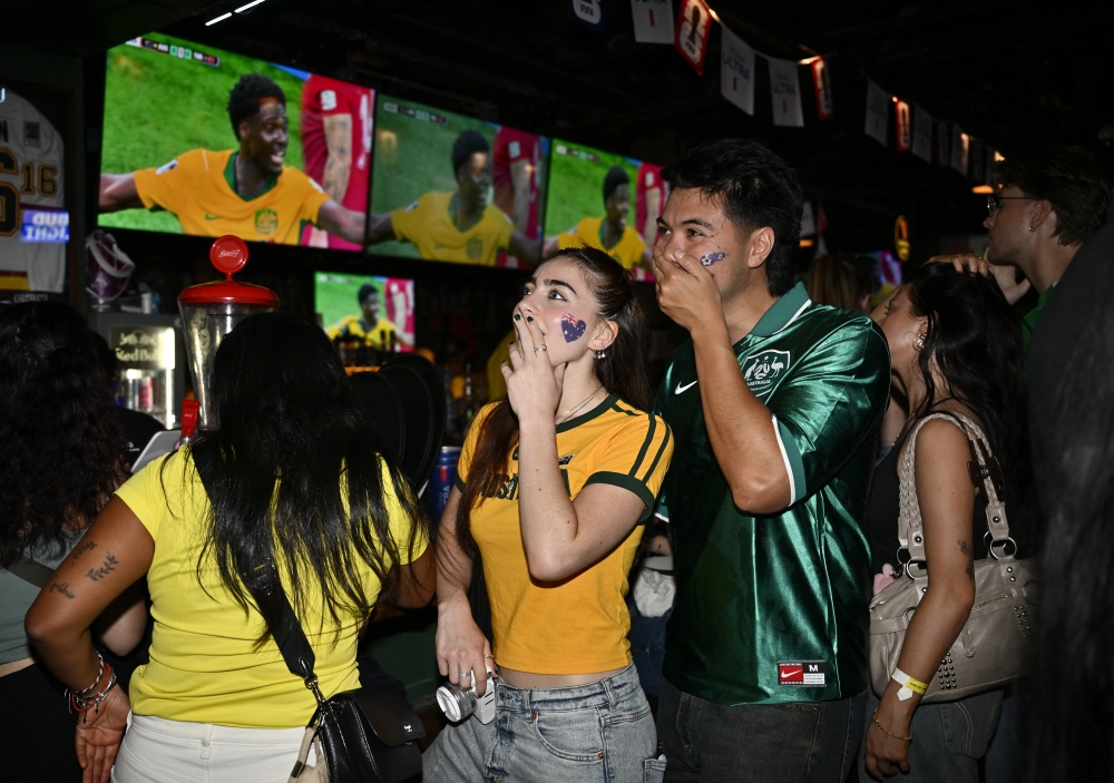 Australia fans watch on in the Dublin Calling bar on Granville Street. — Reuters