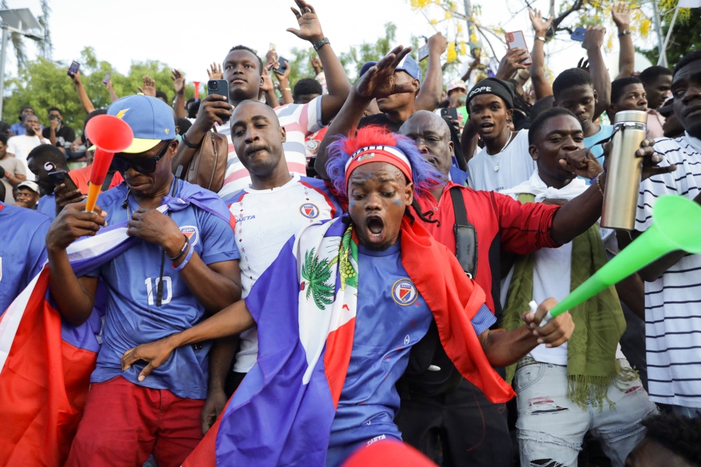 Haitian fans gather to watch the match between Haiti and Scotland. — Reuters