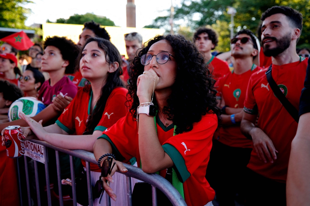 Morocco fans react during the match at the FIFA Fan Zone in Brooklyn. — AFP