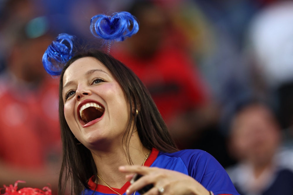 A Haiti fan cheers ahead of the match. — AFP
