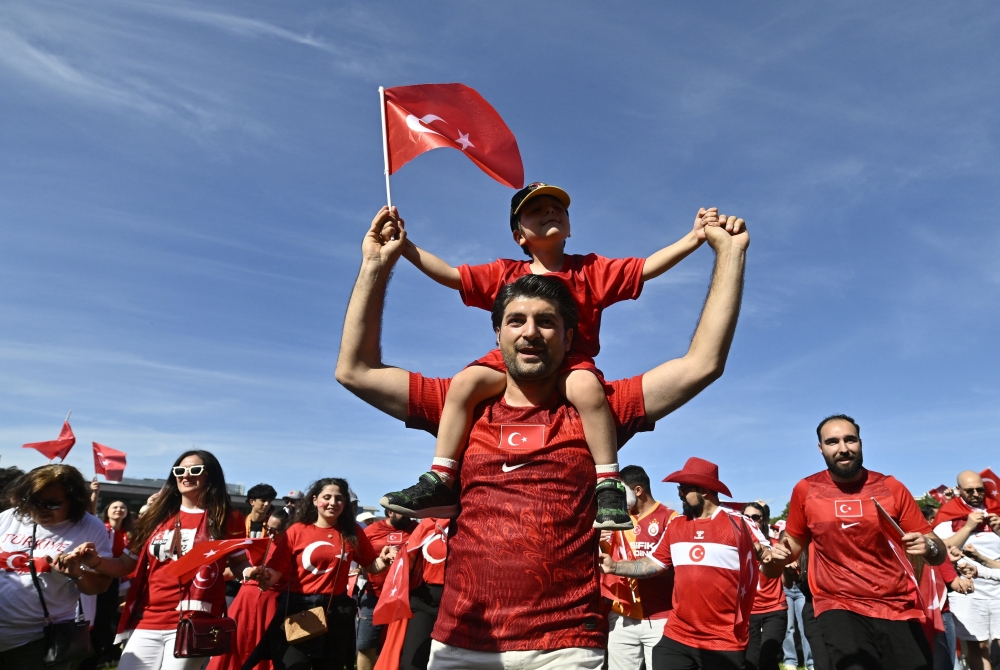 Turkey fans with flags ahead of the match. — Reuters