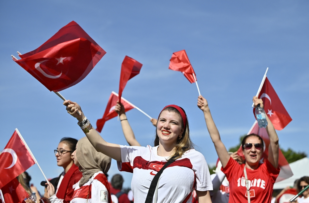Turkey fans with flags ahead of the match. — Reuters