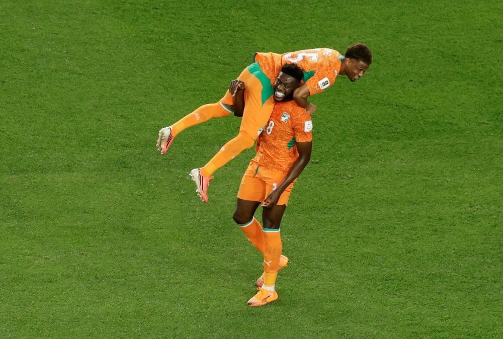 
Ivory Coast's Ibrahim Sangare celebrates with Amad Diallo. — Reuters