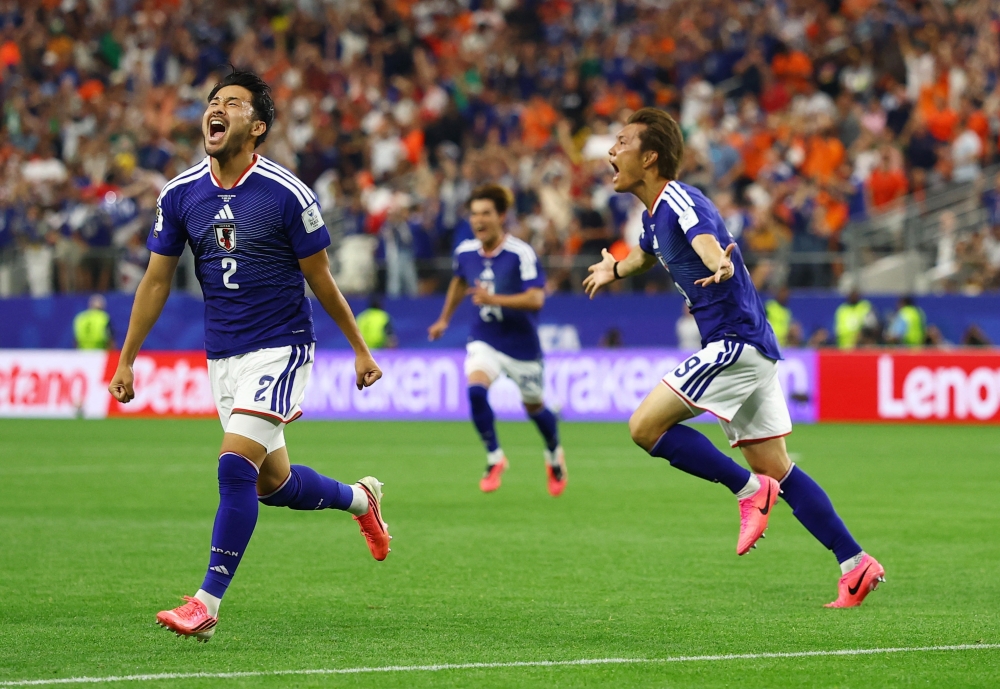  
Japan's Koki Ogawa and Yukinari Sugawara celebrate after Daichi Kamada scored their second goal REUTERS 