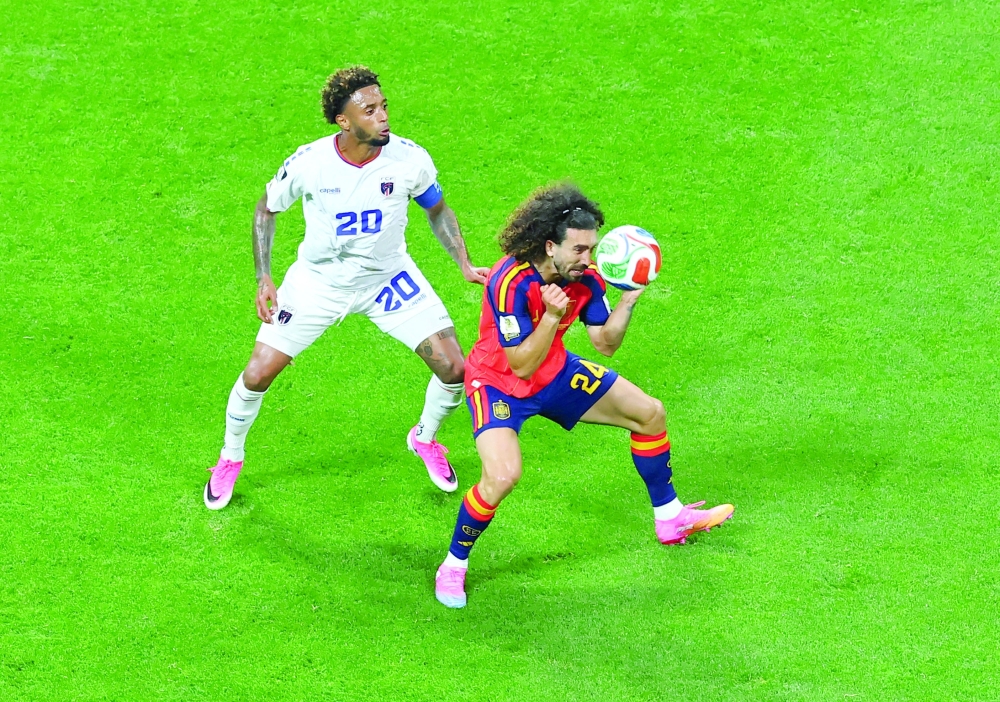 Spain's Marc Cucurella in action with Cape Verde's Ryan Mendes. — REUTERS