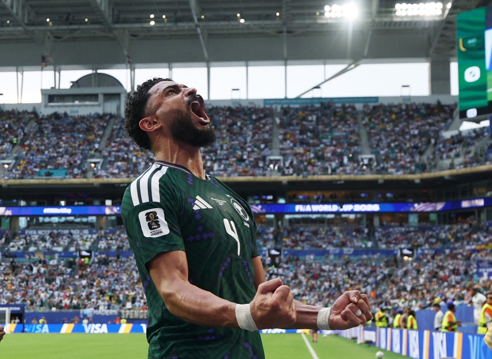  
Saudi Arabia's Abdulelah al Amri celebrates scoring their first goal  