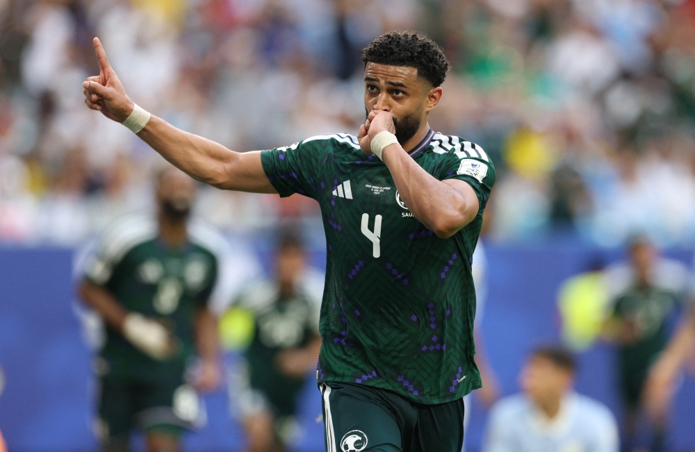  
Saudi Arabia's Abdulelah al Amri celebrates scoring their first goal 
