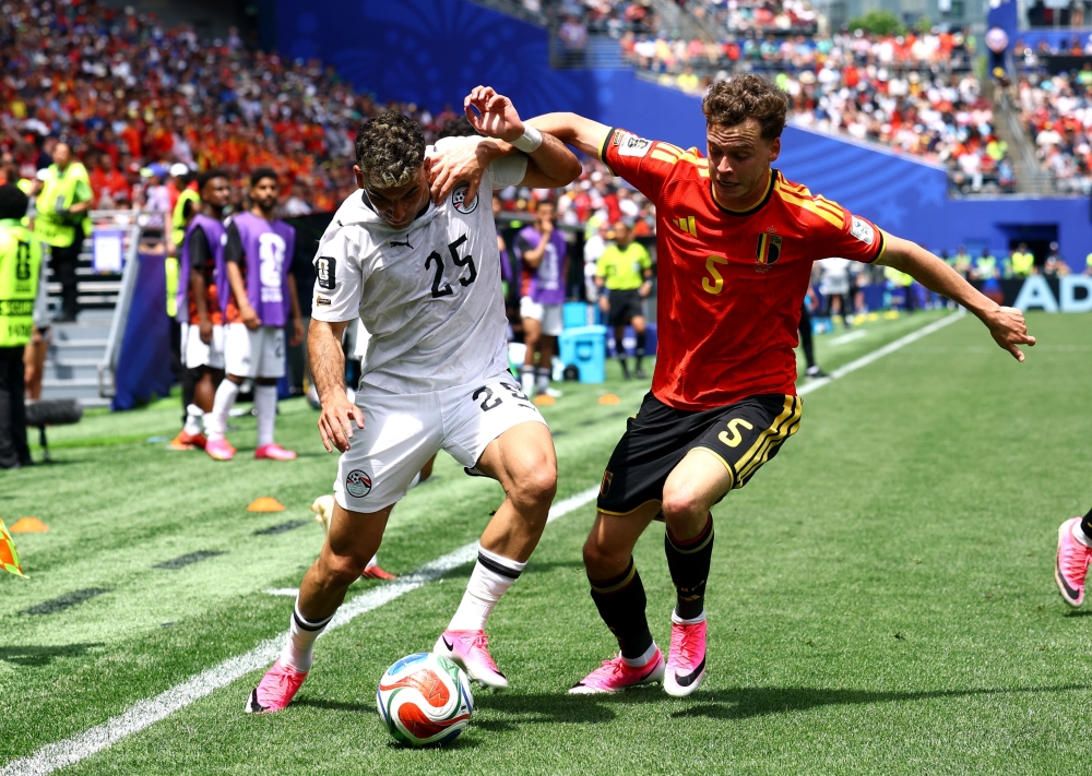  
Egypt's Zizo in action with Belgium's Maxim De. — Reuters