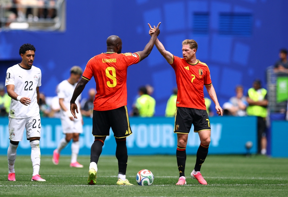 
Belgium's Romelu and Kevin celebrate their first goal. — Reuters