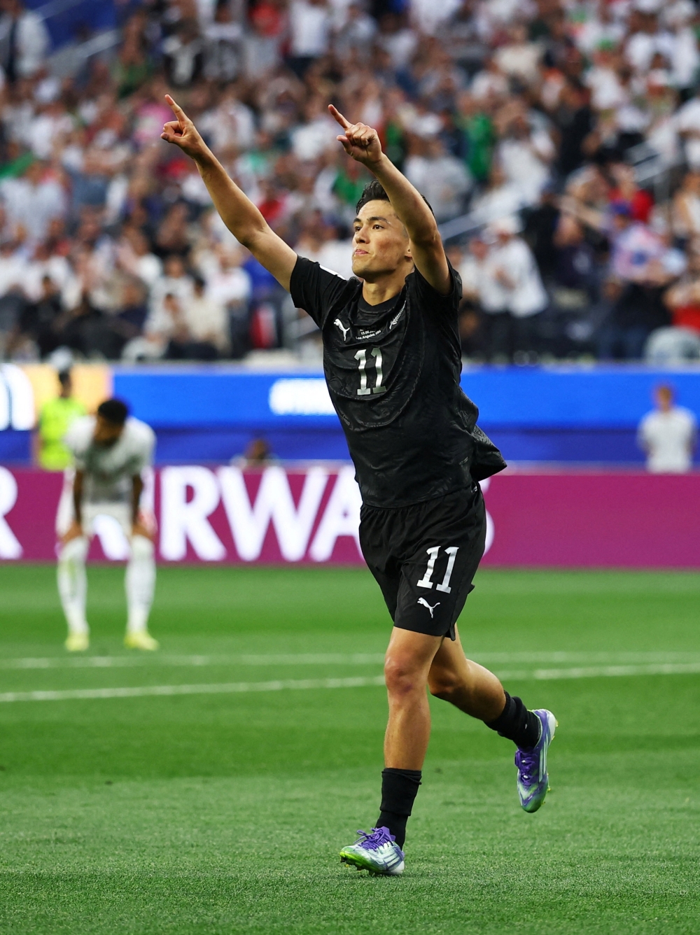    
New Zealand's Elijah Just celebrates scoring their second goal 