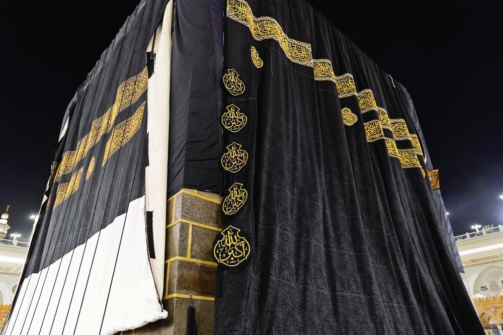 A picture shows the new Kiswah, a black silk and gold-embroidered cloth that covers the Kaaba, at the Grand Mosque in the holy city of Mecca on Tuesday, marking the Islamic New Year. — AFP