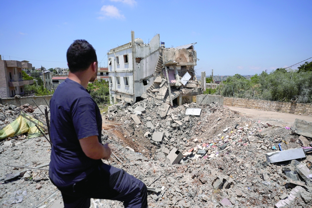 
A man views the site of an Israeli strike in Kfar Sir in the Nabatieh district, Lebanon, on Tuesday. — Reuters 