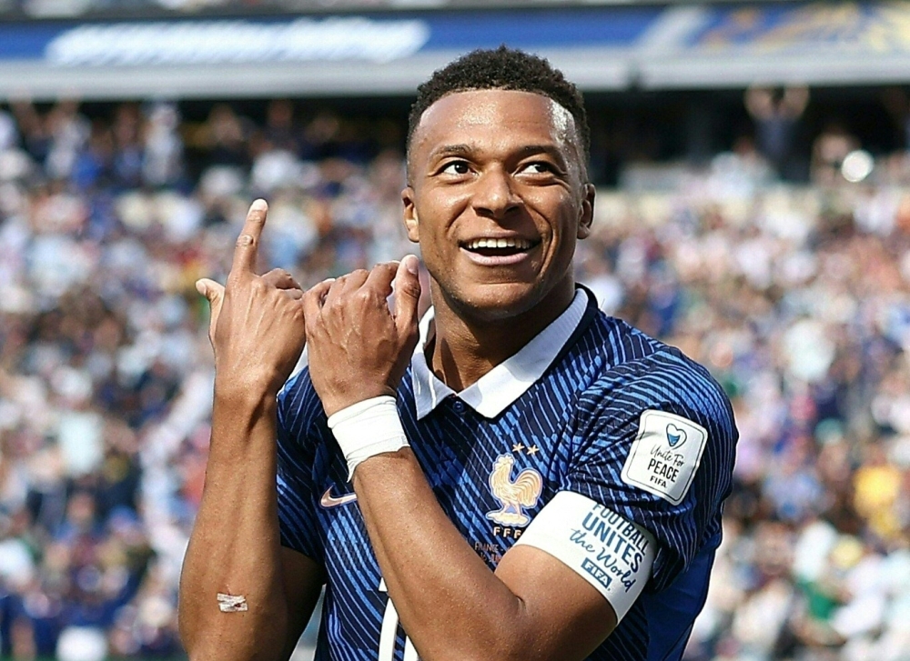 France's forward #10 Kylian Mbappe celebrates after scoring his team's first goal 