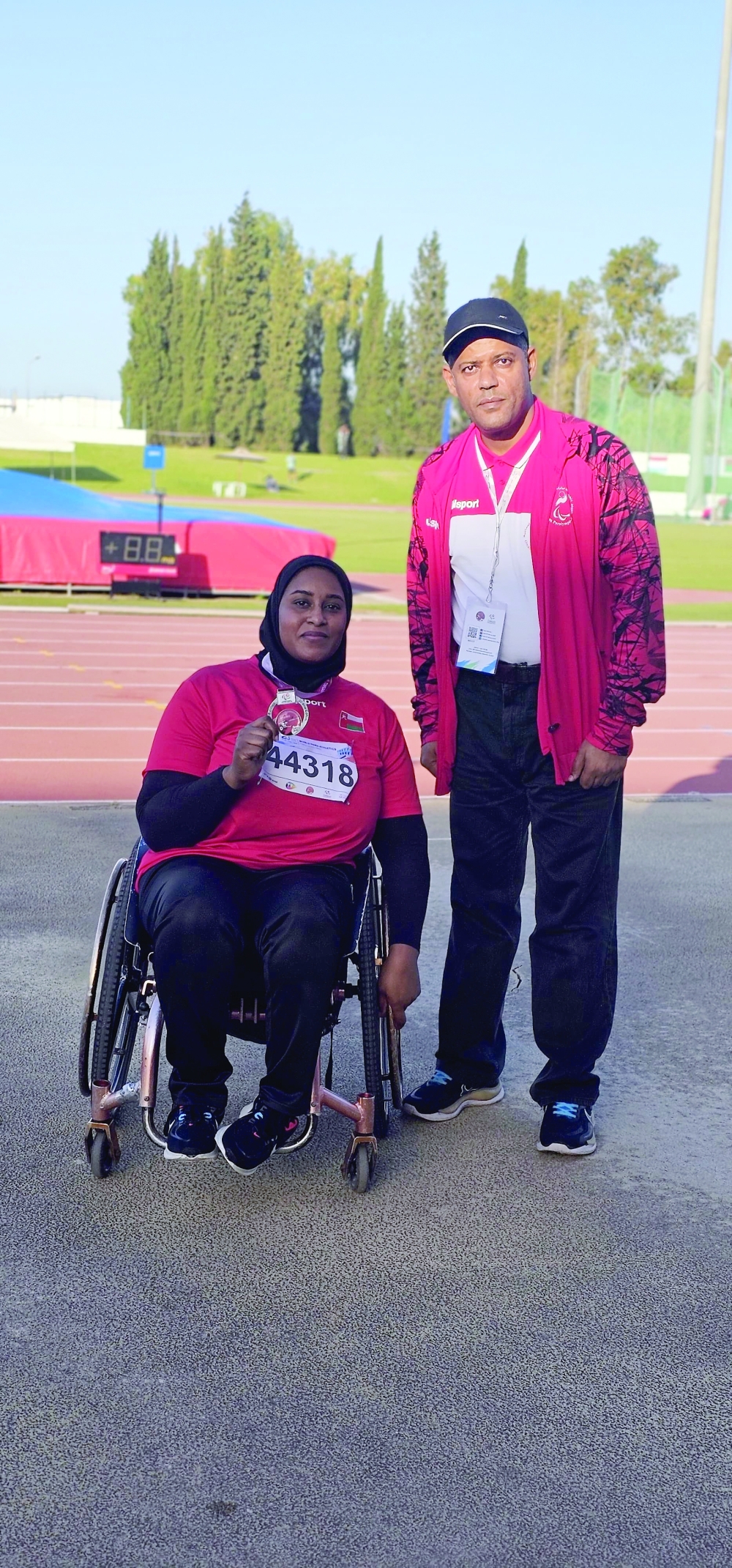 Eman bint Taysir al Shamsi celebrates on the podium after winning silver in the women’s javelin.