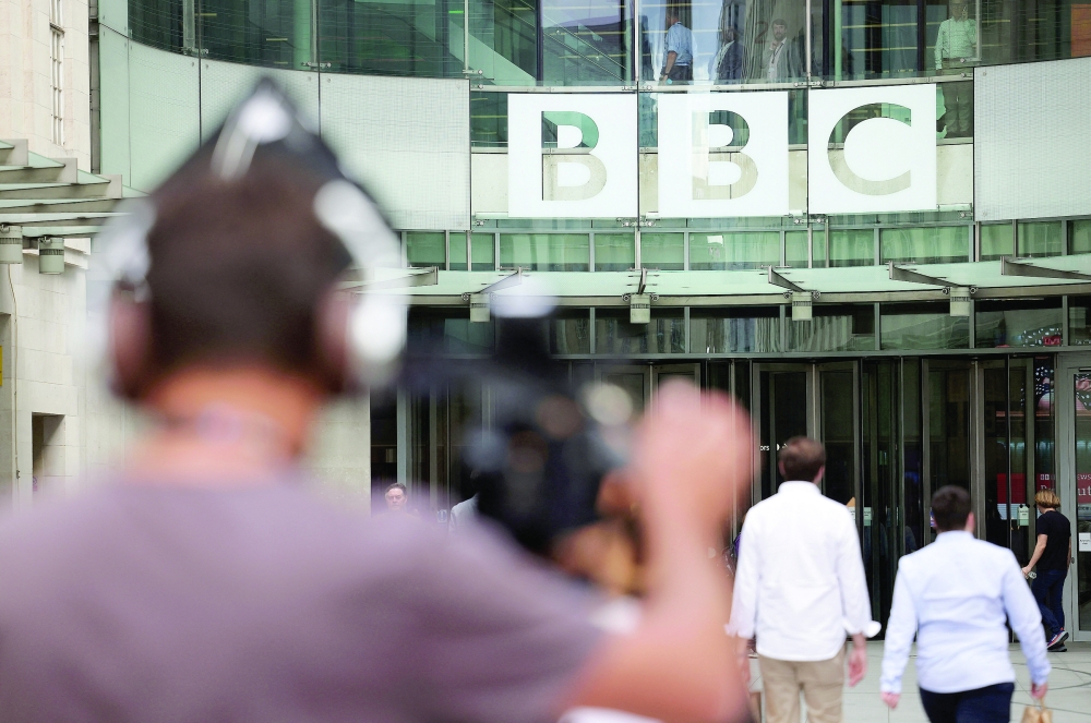 People walk outside the BBC headquarters in London. — A Reuters file photo