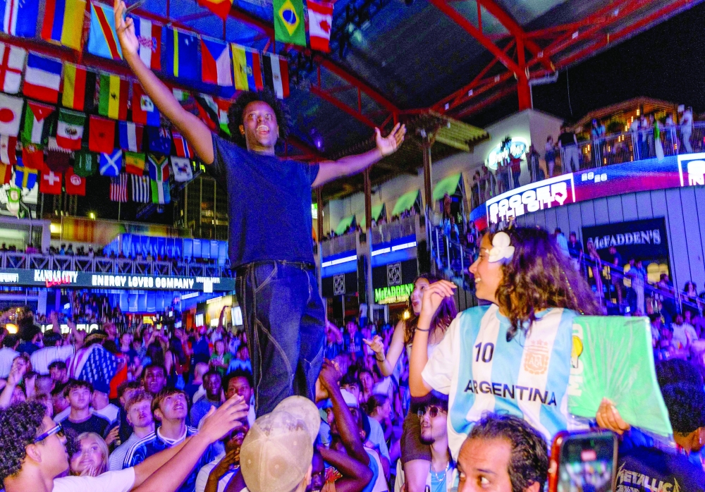Argentina's fans celebrate their team victory at the end of the 2026 World Cup football tournament match between Argentina and Algeria. — AFP