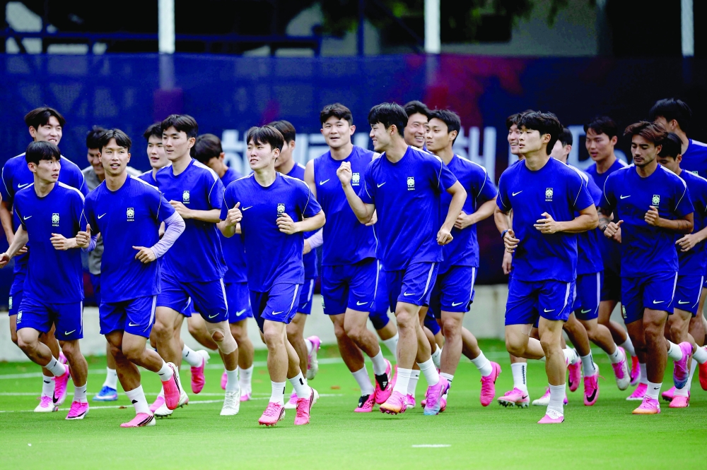 South Korea's players take part in a training session at Chivas Verde Valle in Guadalajara. — AFP