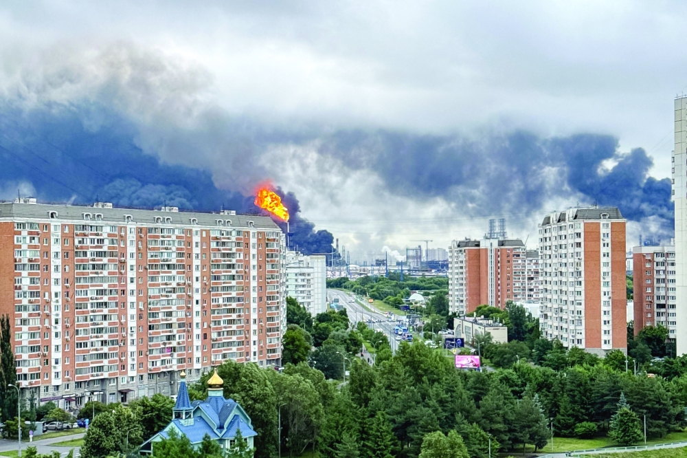 Black smoke rises from the area of the Russian oil producer Gazprom Neft's Moscow oil refinery on the south-eastern outskirts of Moscow. — AFP