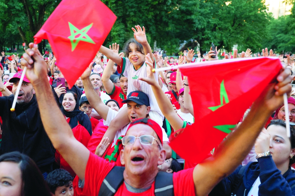 Morocco fans reacts as they gather on the Boston Common ahead of their game against Scotland