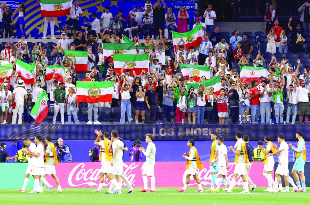 Iran fans celebrate after the match
