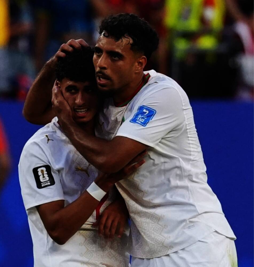  
Morocco's Ayoub Amaimouni and Chadi Riad celebrate after the match 