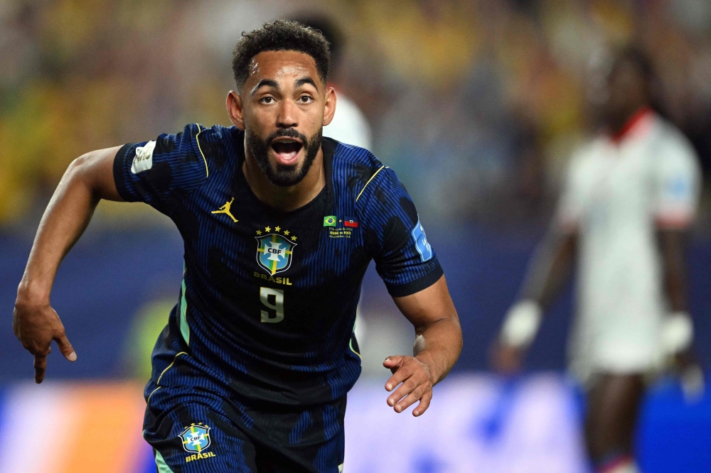 Brazil's forward #09 Matheus Cunha celebrates scoring his team's second goal  
