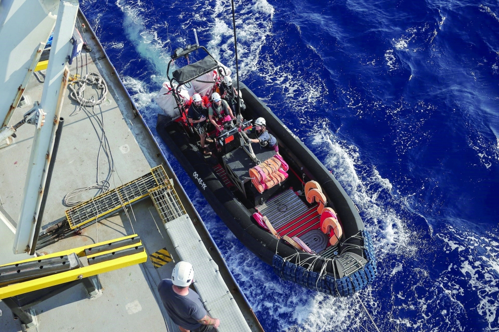 Crew launches a rigid-hulled inflatable boat in the search and rescue zone in the central Mediterranean, off Libya. — Reuters