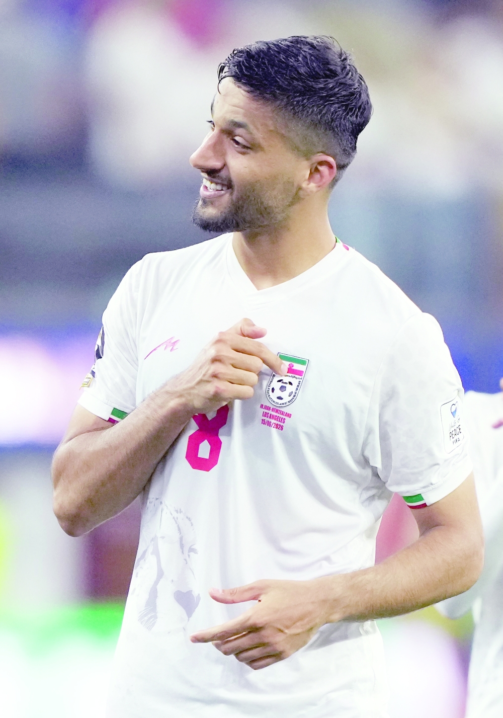  
Iran's Mohammad Mohebbi salutes their fans. — Reuters