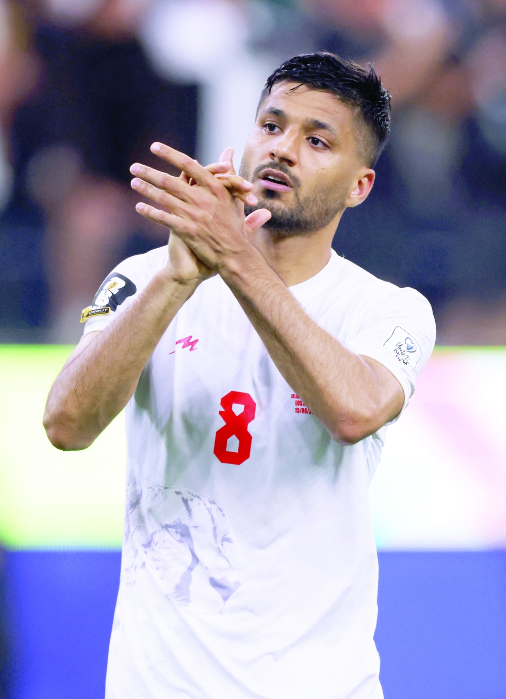  
Iran's Mohammad Mohebbi applauds fans. — Reuters