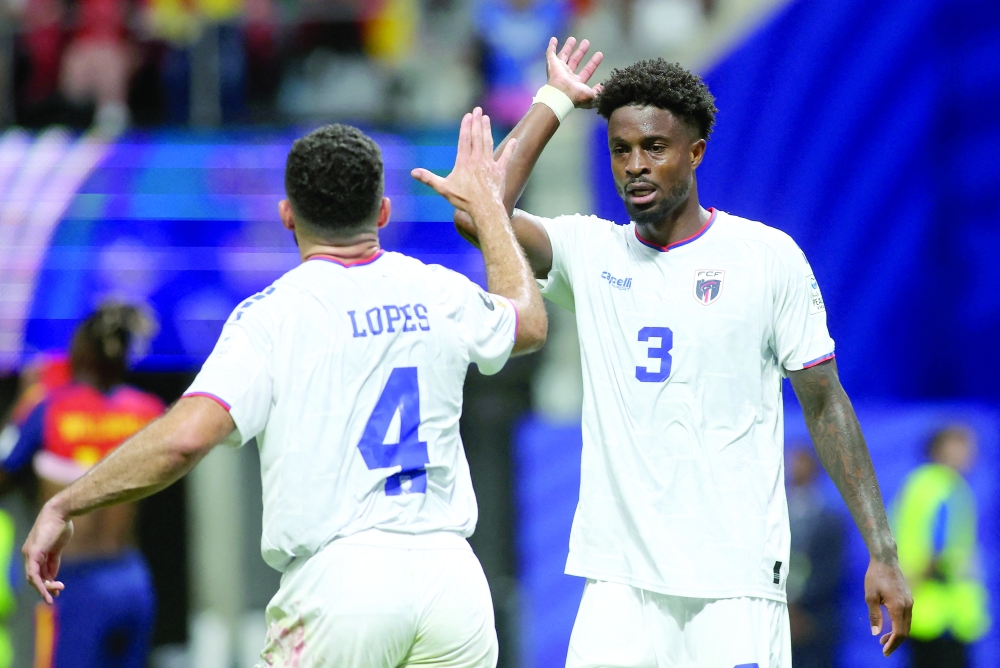  
Cape Verde's Diney Borges celebrates after the match with Pico Lopes. — Reuters