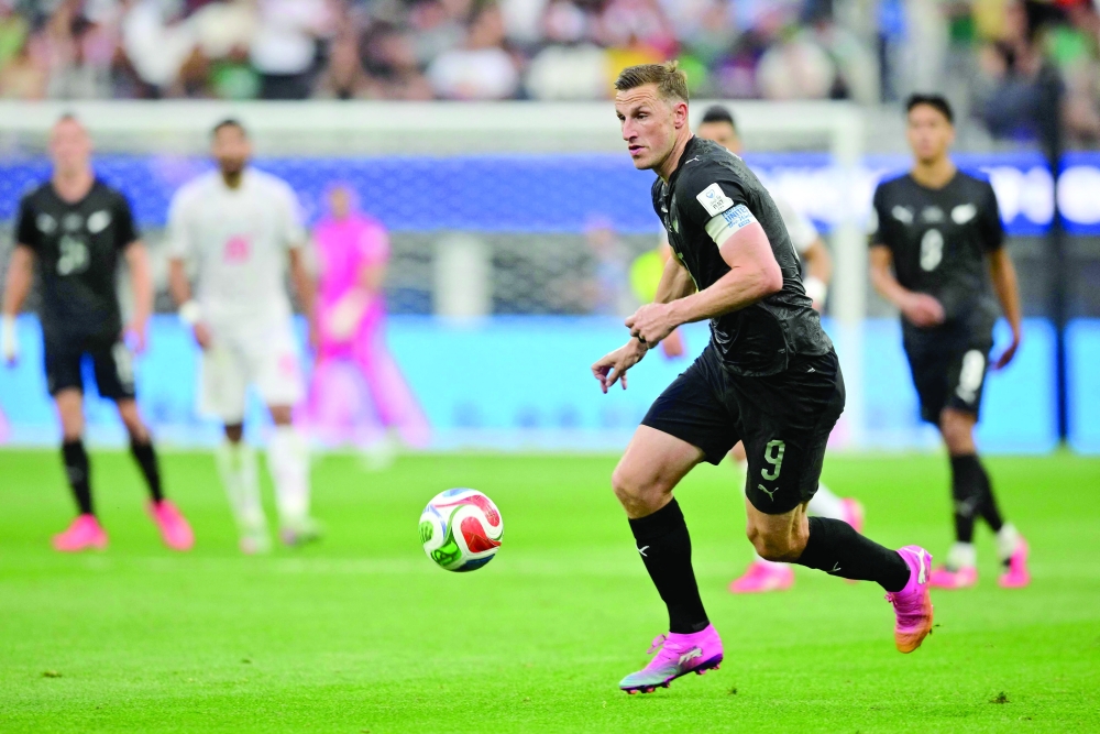 New Zealand's forward #09 Chris Wood runs with the ball. — Reuters