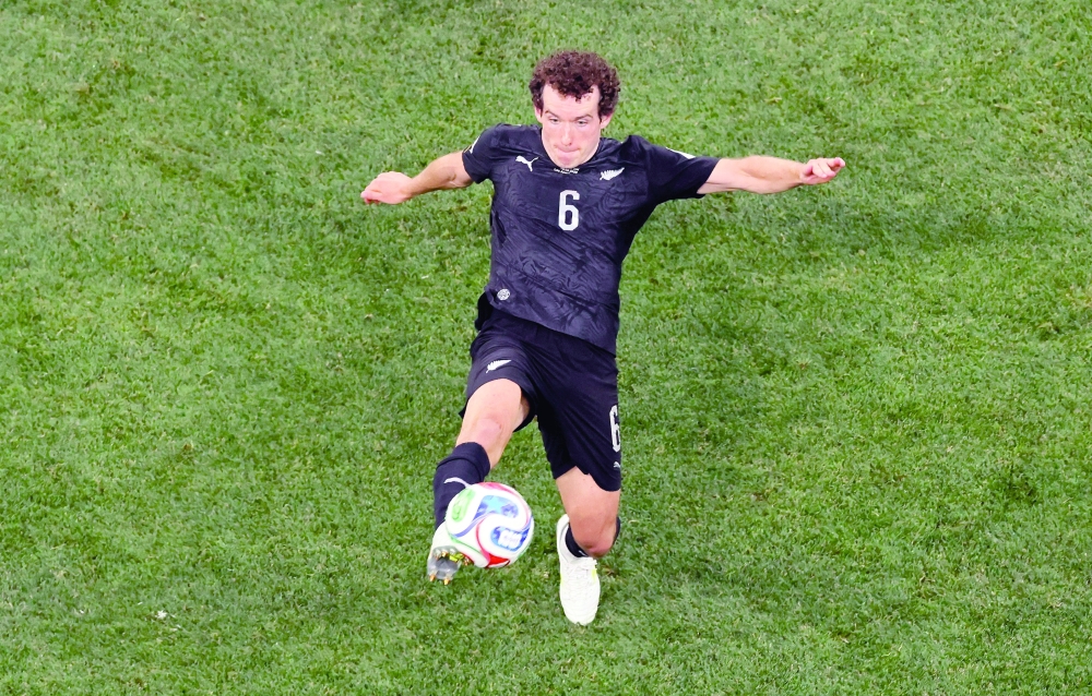 New Zealand's #06 Joe Bell kicks the ball. — AFP 