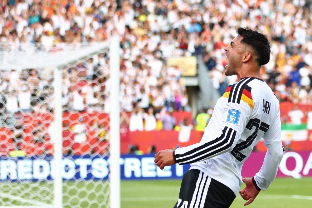 Germany's midfielder #20 Nadiem Amiri celebrates second goal. — AFP
