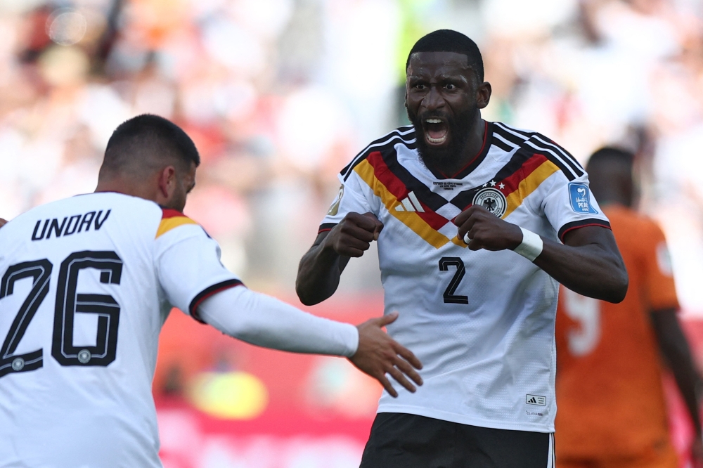 Germany's #02 Antonio Ruediger (R) congratulates Germany's #26 Deniz Undav for his goal. — AFP
