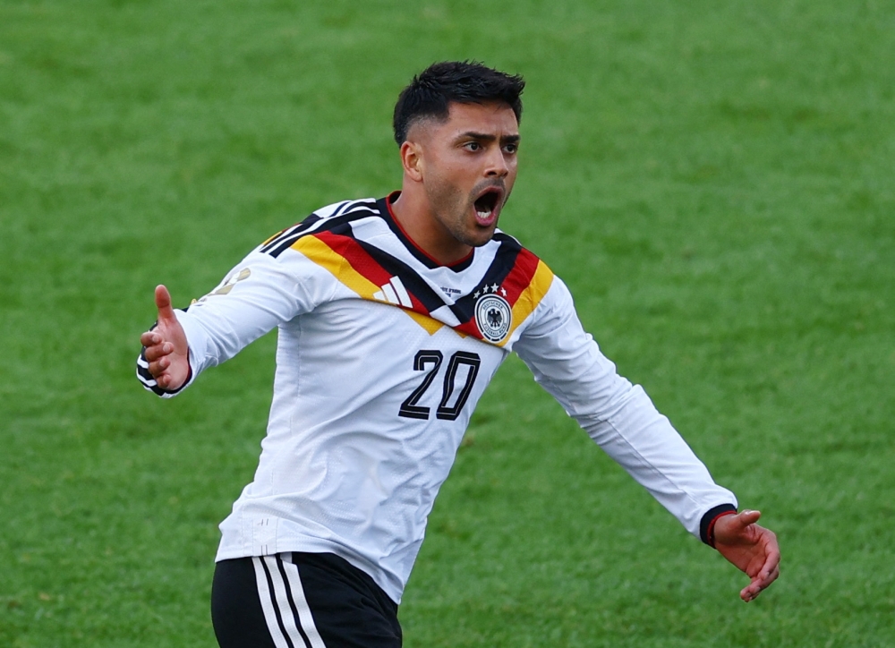  
Germany's Nadiem Amiri celebrates their first goal, scored by Deniz Undav. — Reuters