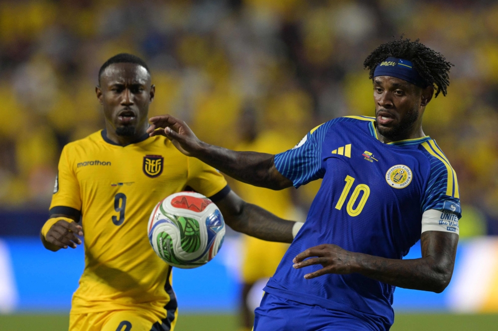 Ecuador's #09 John Yeboah and Curacao's #10 Leandro Bacuna fight for the ball. — AFP