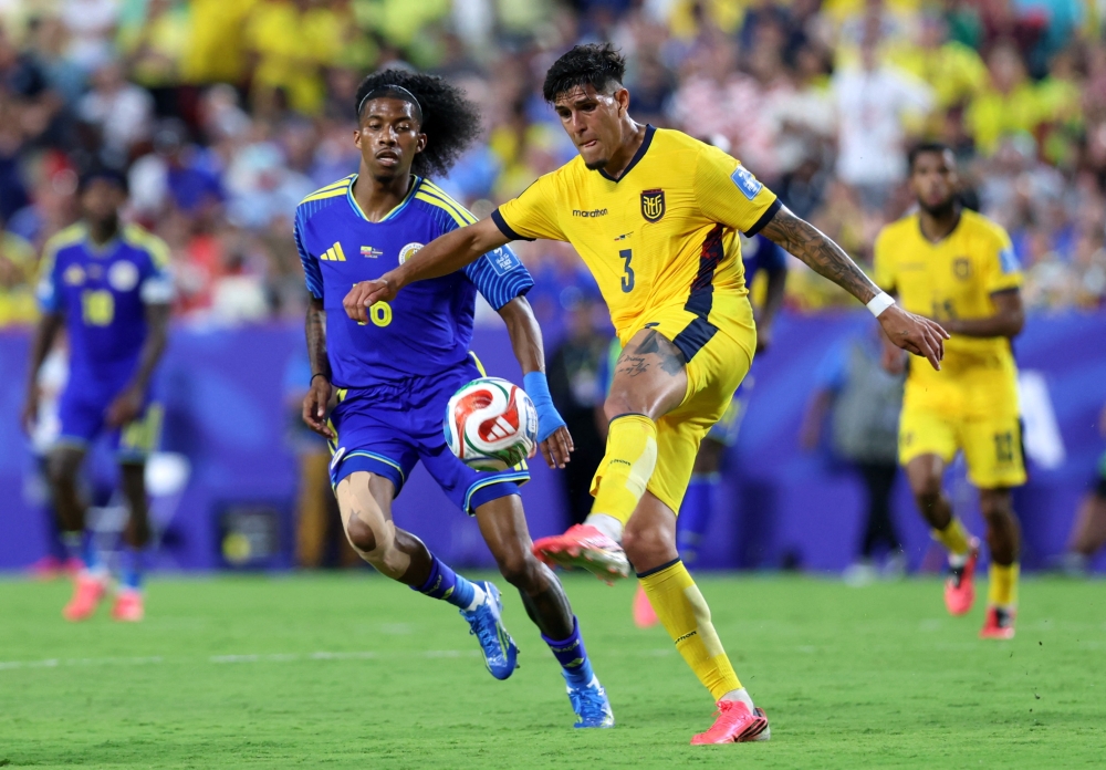  
Ecuador's Piero Hincapie in action with Curacao's Jearl Margaritha. — Reuters