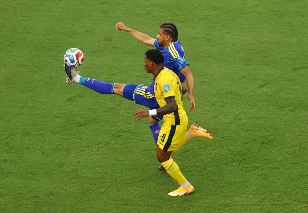  
Curacao's Armando Obispo in action with Ecuador's Gonzalo Plata. — Reuters