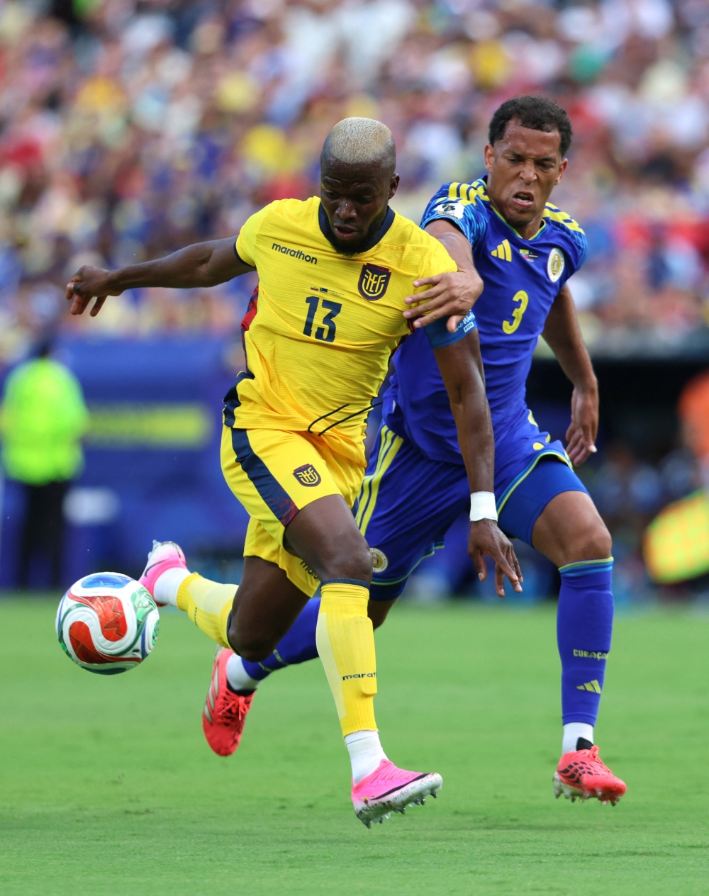  
Ecuador's Enner Valencia in action with Curacao's Jurien Gaari. — Reuters
