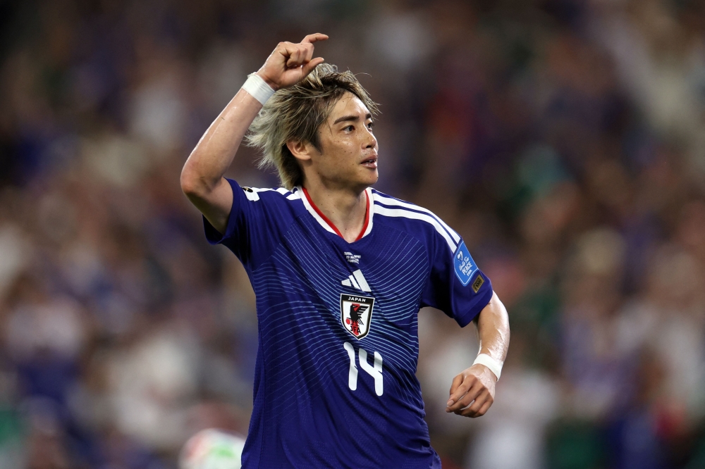 Japan's #14 Junya Ito celebrates after scoring third goal. — AFP