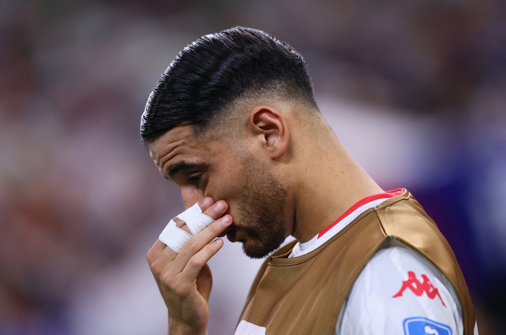 
Tunisia's Hadj Mahmoud reacts. — Reuters