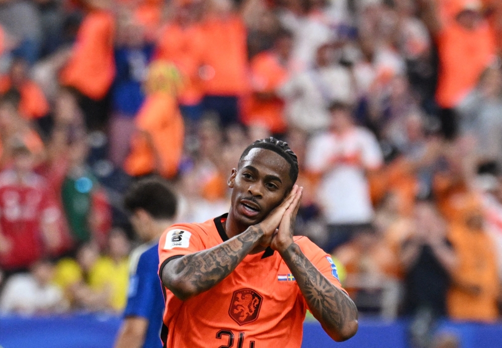  
Netherlands' Crysencio Summerville celebrates scoring their fifth goal 