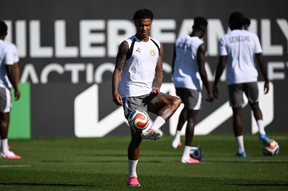 Senegal's  #14 Ismail Jakobs during training. — AFP