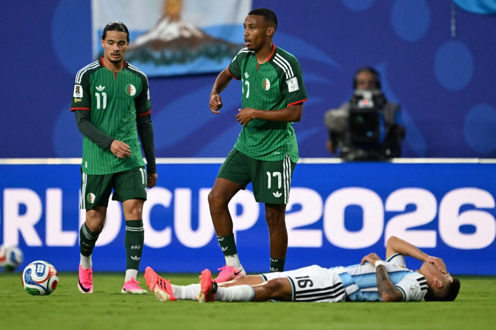 Algeria's #11 Anis Hadj Moussa and #17 Rafik Belghali. — AFP